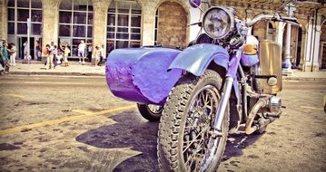 purple vintage motorbike on street, cuba, havana