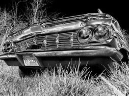 black and white photo of a wrecked car