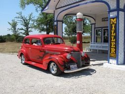 red vintage car at fuel station, usa, chicago