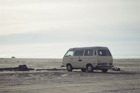 hippy van car on a sandy beach