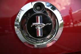 Ford Mustang logo on the red car