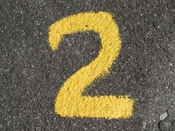 yellow number two on the road