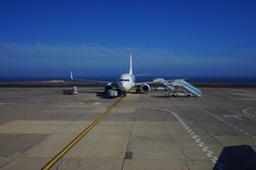 white plane on the runway