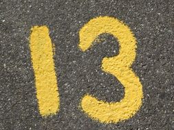 yellow number thirteen on the road