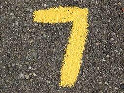 yellow number 7 on the asphalt