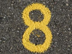yellow number eight on the road