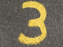 number three written on the pavement