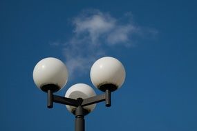 street lamp in the background of clouds