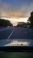 view from the car on the highway road at dawn