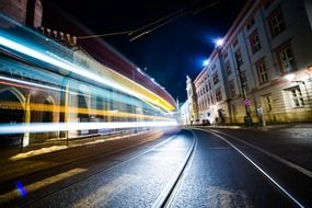 tram rides through the night city