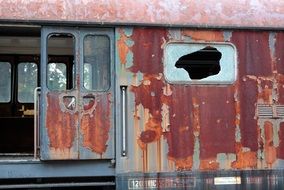 Old rusted wagon on a railway station