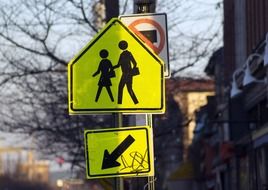 yellow traffic signs on a road