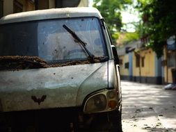 abandoned old car on street