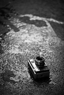 vintage photo camera on wet road