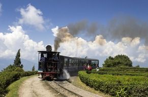 steam locomotive on railway in beautiful landscape, india, darjeeling