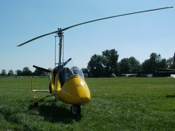 gyrocopter on lawn at summer