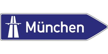blue road sign on munich