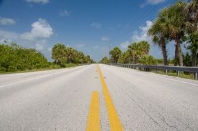 yellow dividing strip on asphalt