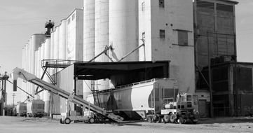 black white photo of train loading