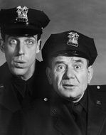 Joe E Ross and Fred Gwynne as Police Officers