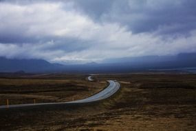 road in iceland against the background of clouds