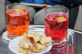 drinks with lemon in glass glasses as an aperitif