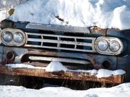 the front of the car is covered in snow