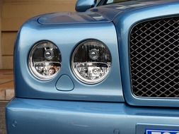 headlights of blue Bentley