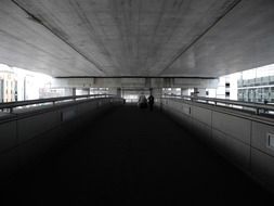 Monochrome photo of walkway in railway station in Japan