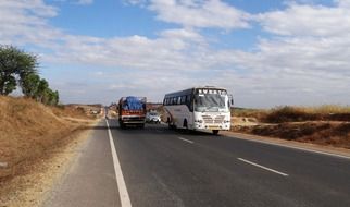 highway asphalt road with bus traffic