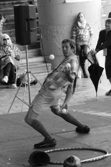 black and white photo juggler