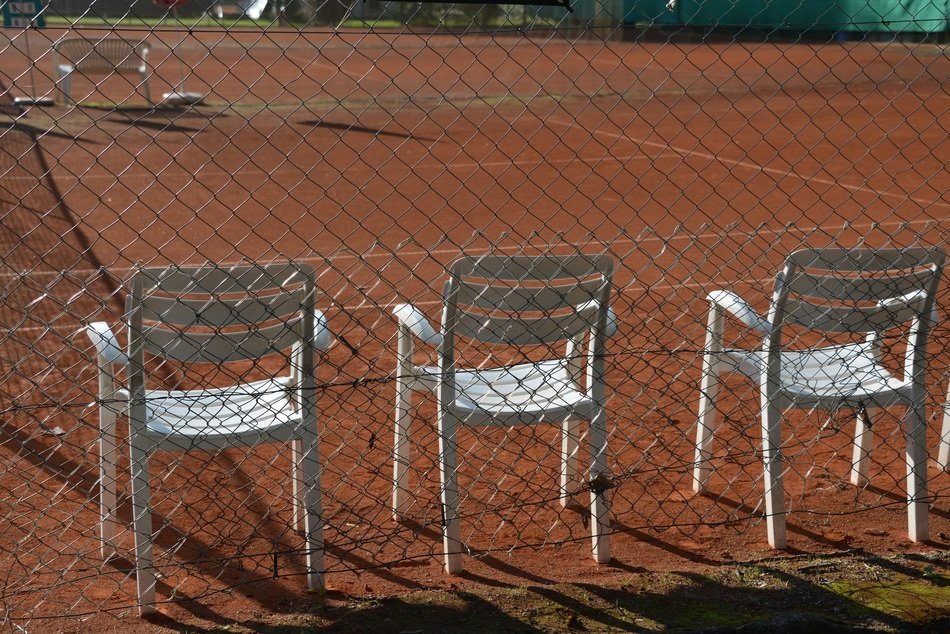 chairs on the tennis court
