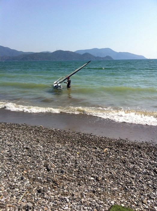 windsurfer on the waves near the beach