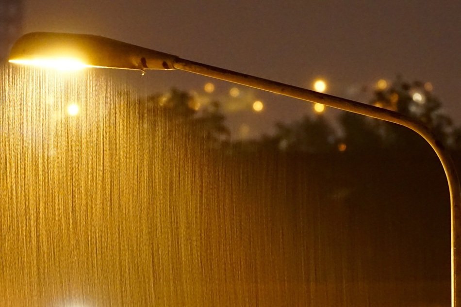 Lighting on the road at rainy night