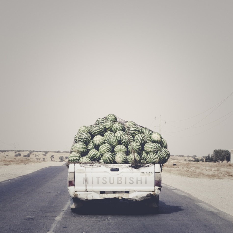 car with watermelons on the highway