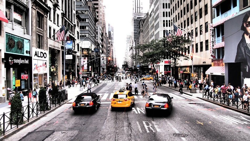 Yellow cab and black cars in New York