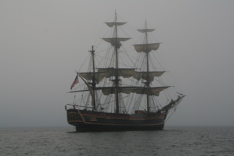 schooner in the ocean in the fog