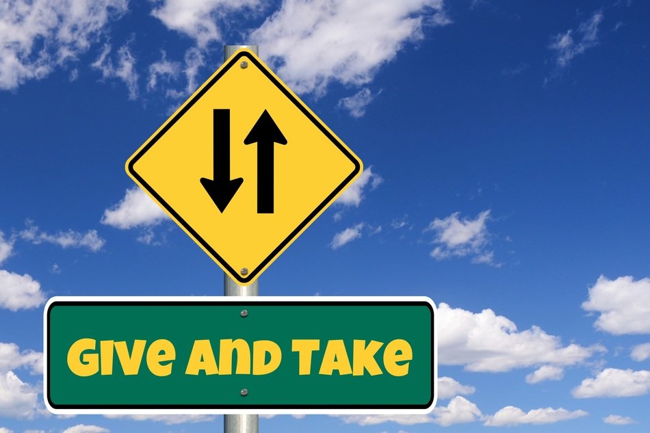 road sign on a sky background with clouds