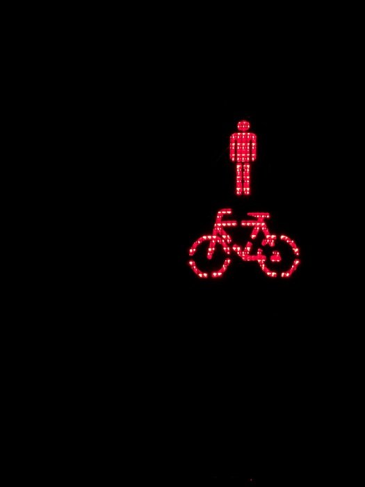 man near bike as a sign on black background