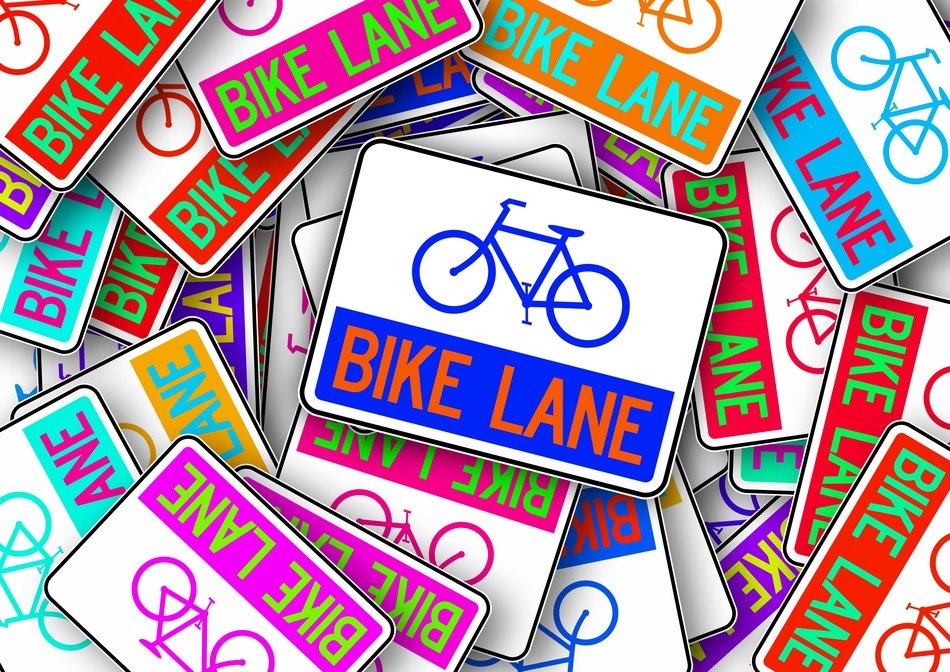 many colorful signs with a image of a bicycle