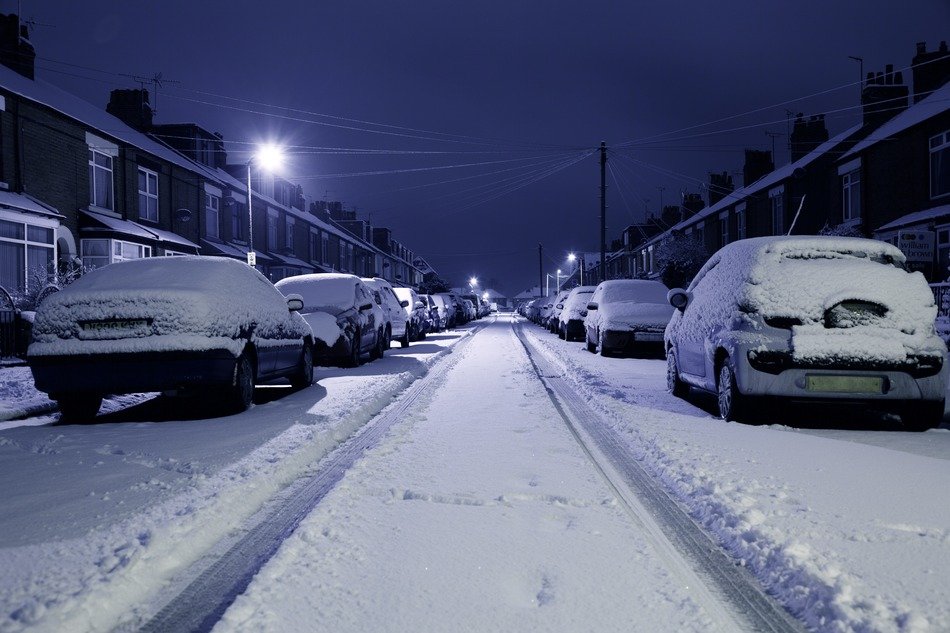 snowy cars along the road