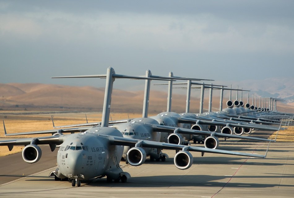 cargo planes lined up on the runway