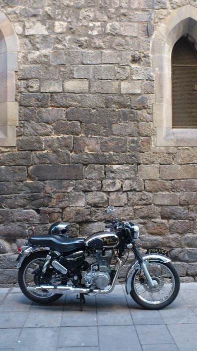 motorcycle at the stone wall