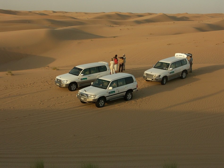 photo of all terrain vehicles in a desert