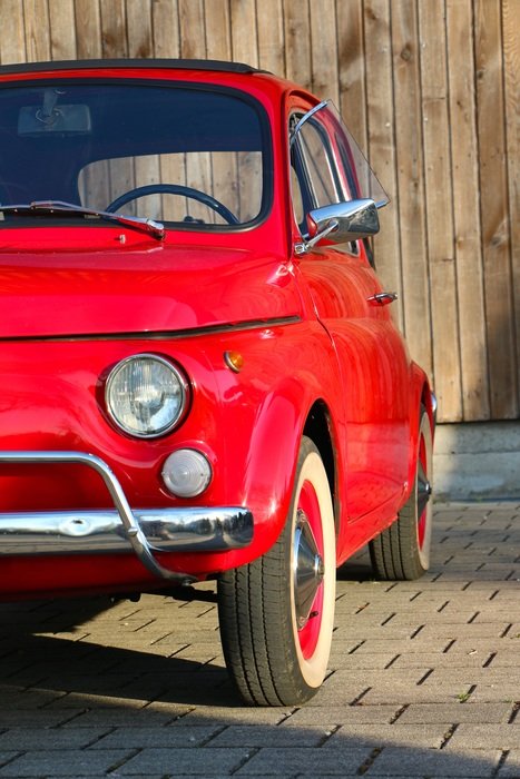 red Fiat 500 on the road