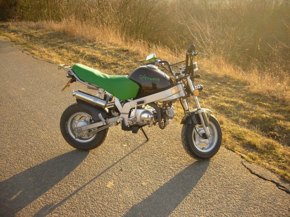 motorcycle with a green seat