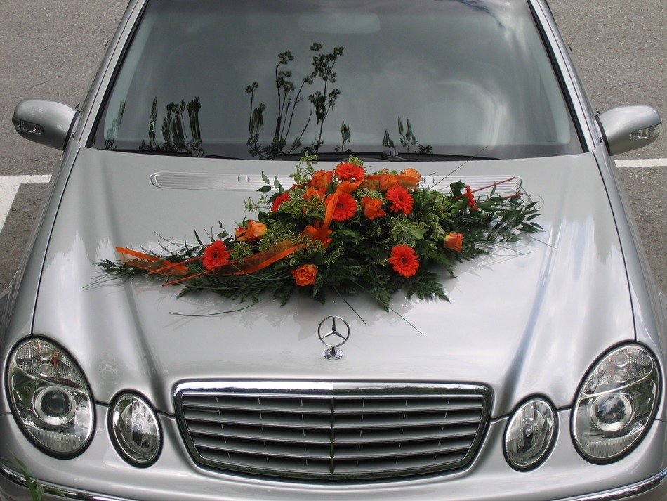 new grey mercedes car with floral arrangement