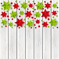 Xmas starry decorations on white wooden background