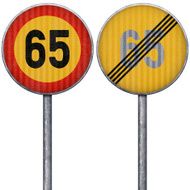 Two yellow and red maximum speed limit 65 road signs