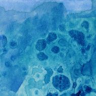Blue hand painted watercolor texture with spots